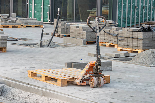 A construction site with a forklift moving building materials, highlighting efficient material handling a