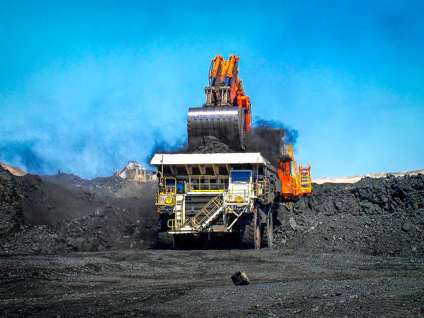 Loading the heavy dump truck at an open cut coal mine in Queensland's Loading the heavy dump truck at an open cut coal mine in Queensland's